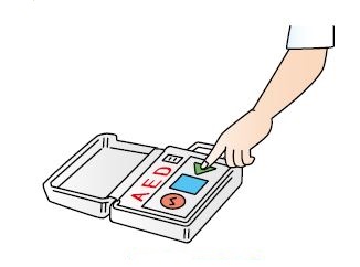 AEDの電源を押す図