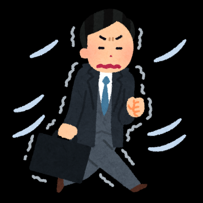 寒い季節の風を受けている会社員